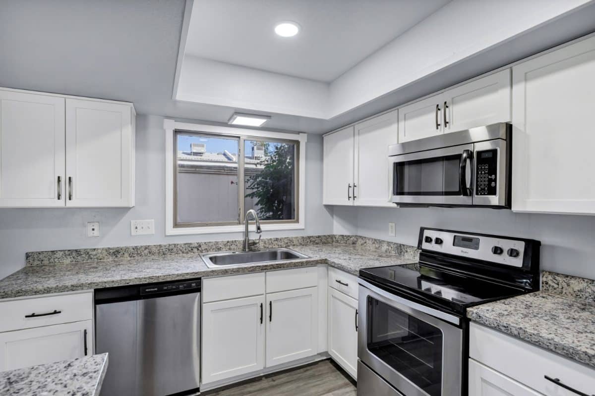 Updated kitchen with shaker cabinets, granite countertops and stainless steel appliances at 14 E Hermosa Dr